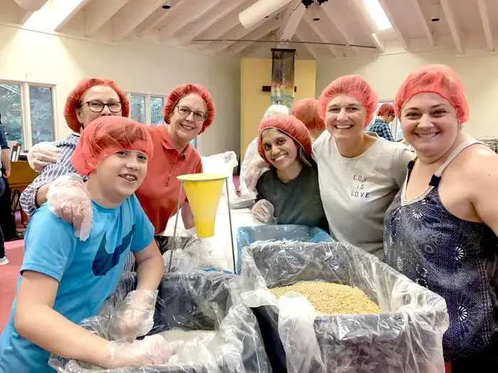 Church volunteers pack 25,000 meals for nonprofit