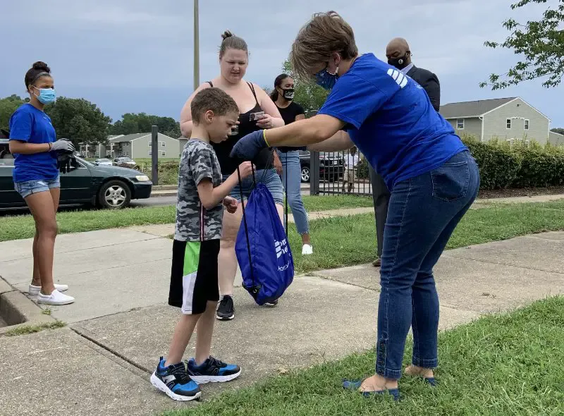 Dominion Energy distributes backpacks at St. Luke Apartments