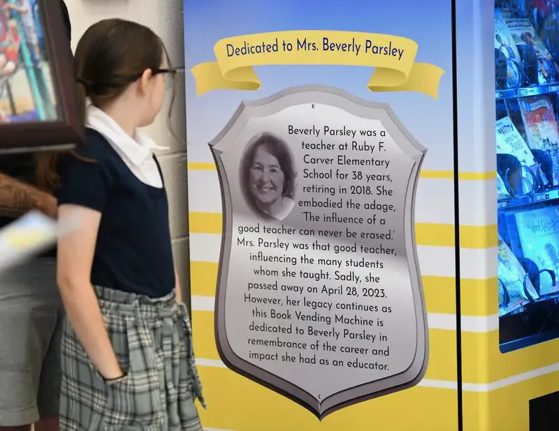 Carver ES dedicates book vending machine in honor of longtime teacher