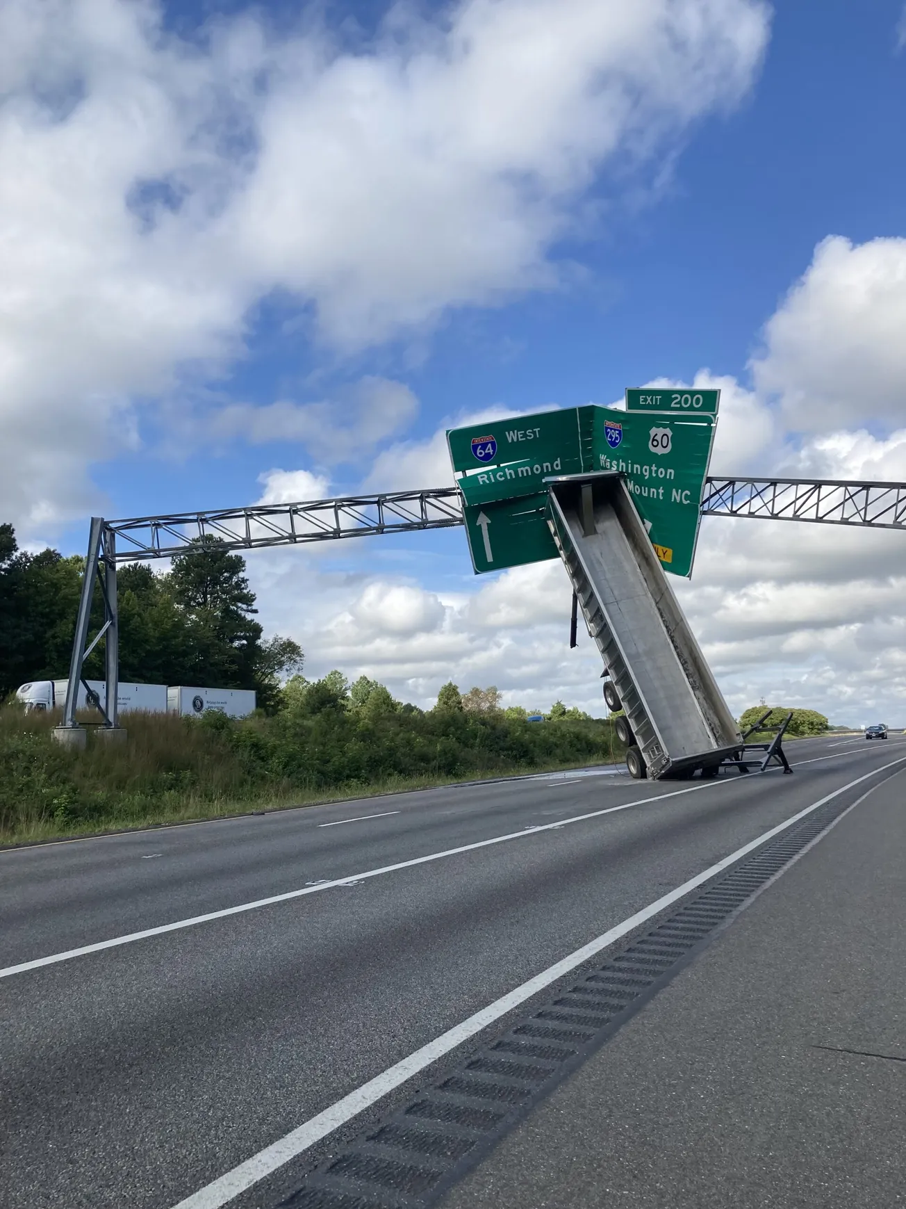 Tractor-trailer driver faces charges after I-64 sign incident